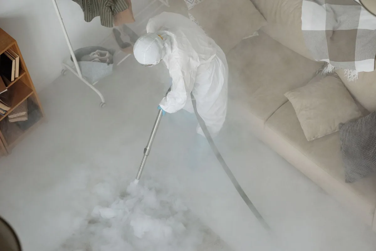 Biohazard cleanup technician in protective equipment, Los Ranchos, CA